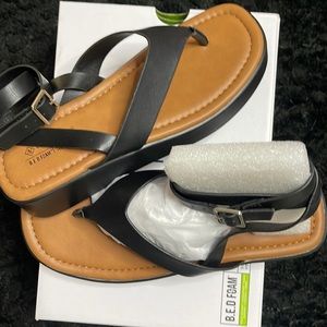Womens sandals, new in box.  Strap wraps around ankle and buckles.